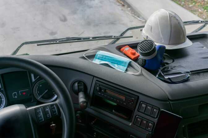 Personal protective equipment in the cabin of a truck that trans