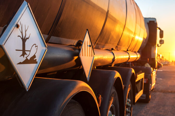 Contamination hazard labels on a tanker truck for the transport